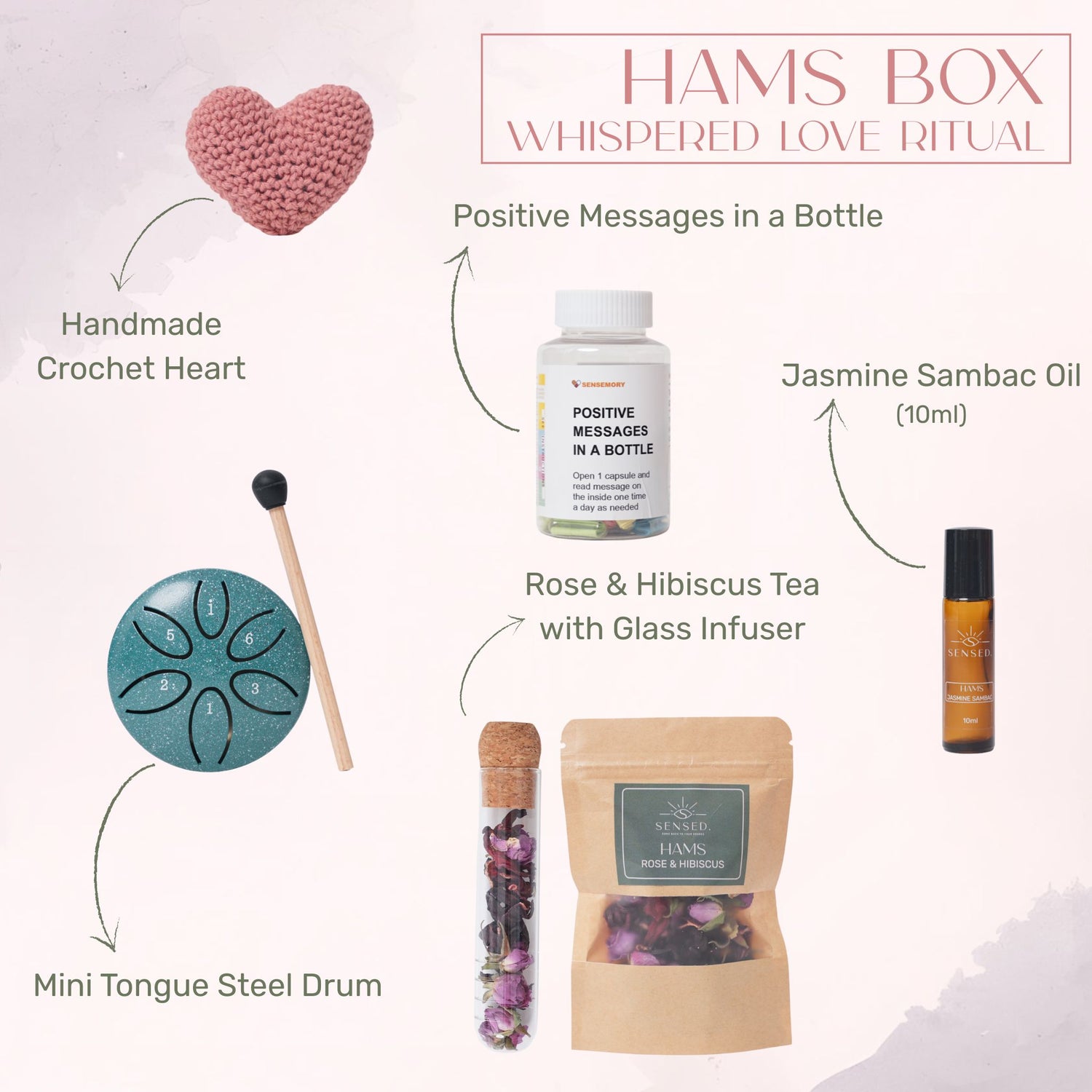 Hams box contents including crochet heart, jasmine sambac oil, rose hibiscus tea, affirmations bottle, and mini tongue drum in Kuwait.